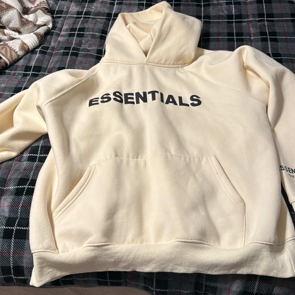 Essentials hoodie, size large.